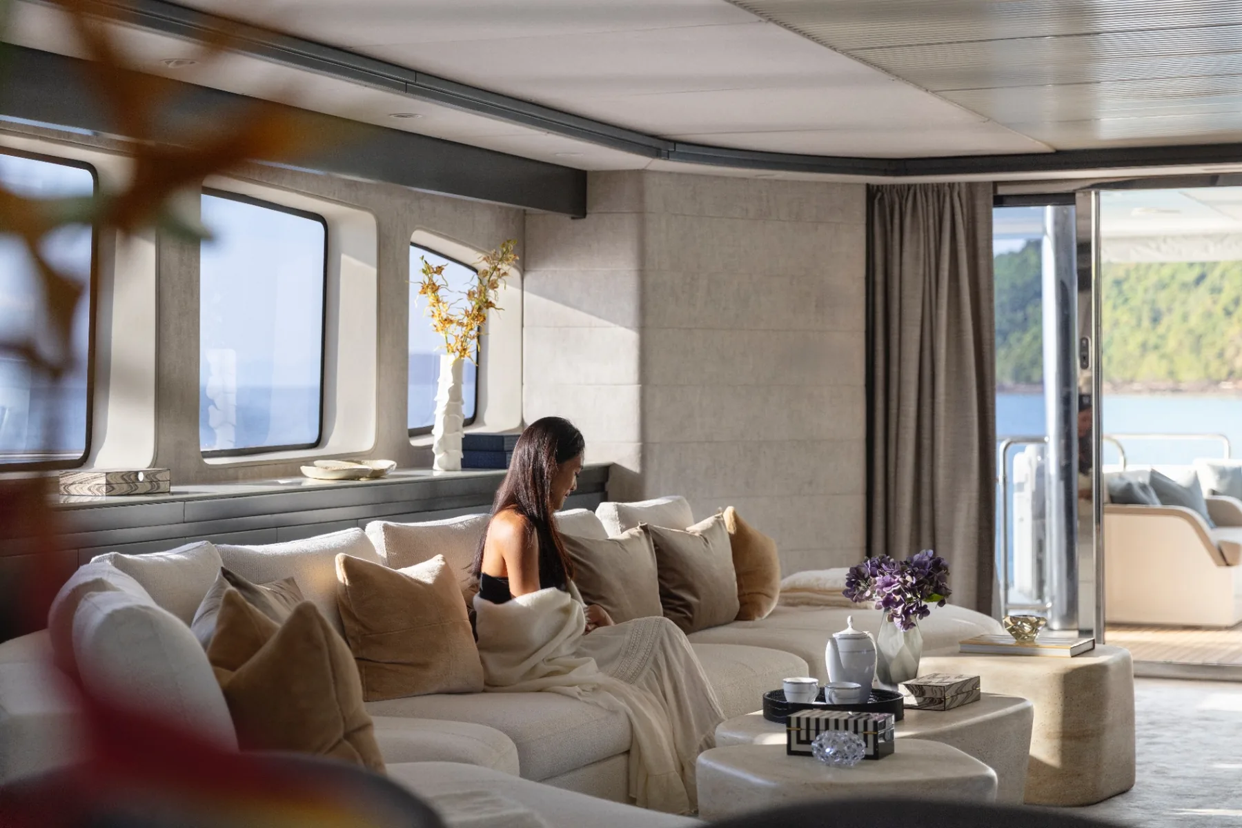 Lifestyle moment in the main saloon of superyacht Panakeia in Thailand