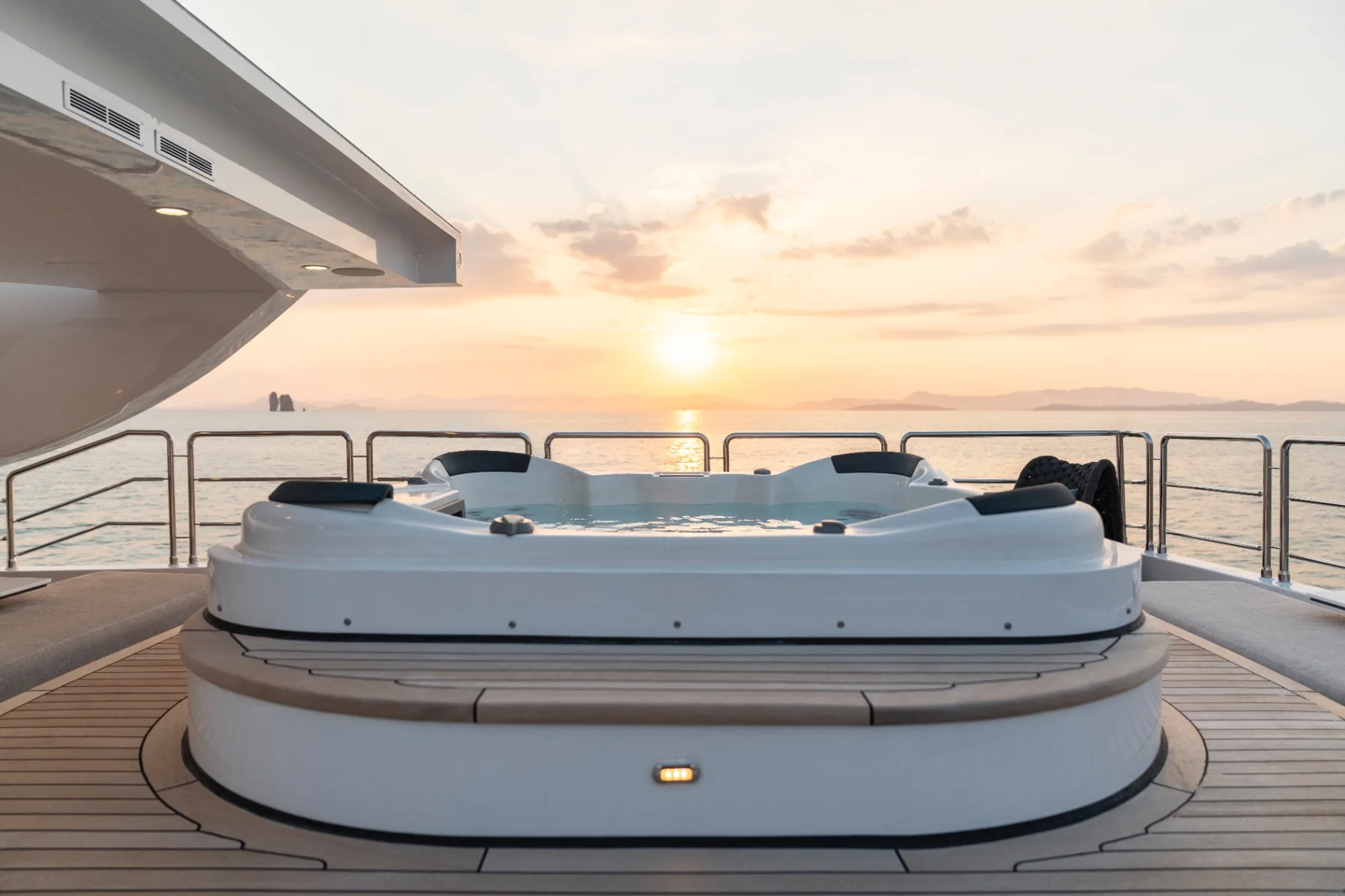 Sun deck jacuzzi with sunset over the Andaman Sea, Thailand
